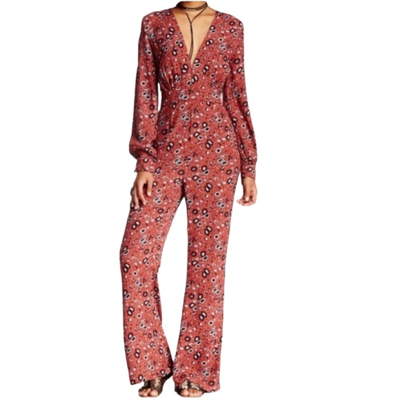 FREE PEOPLE Some Like It Hot Floral Print V-Neck Flare Leg Jumpsuit Rust Combo